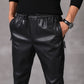 Statement-making black harem pants with a faux leather finish
