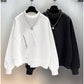 "Edgy black hoodie with minimalist techwear design"