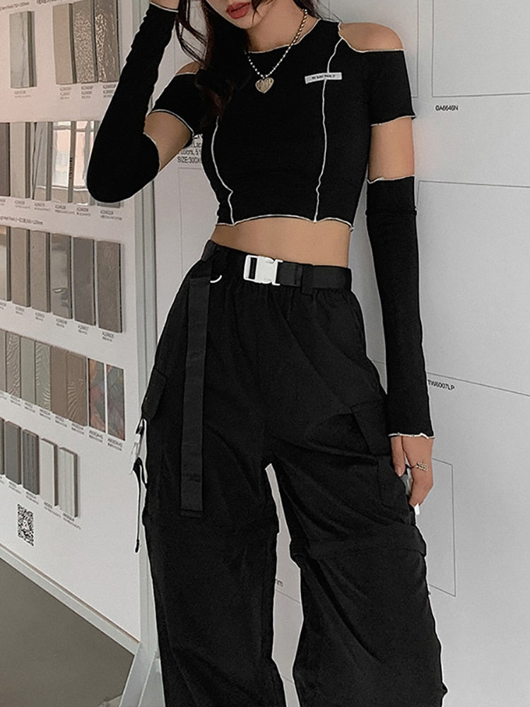 "Dark and alluring Gothic crop top with unique patchwork and sexy open shoulder cut."