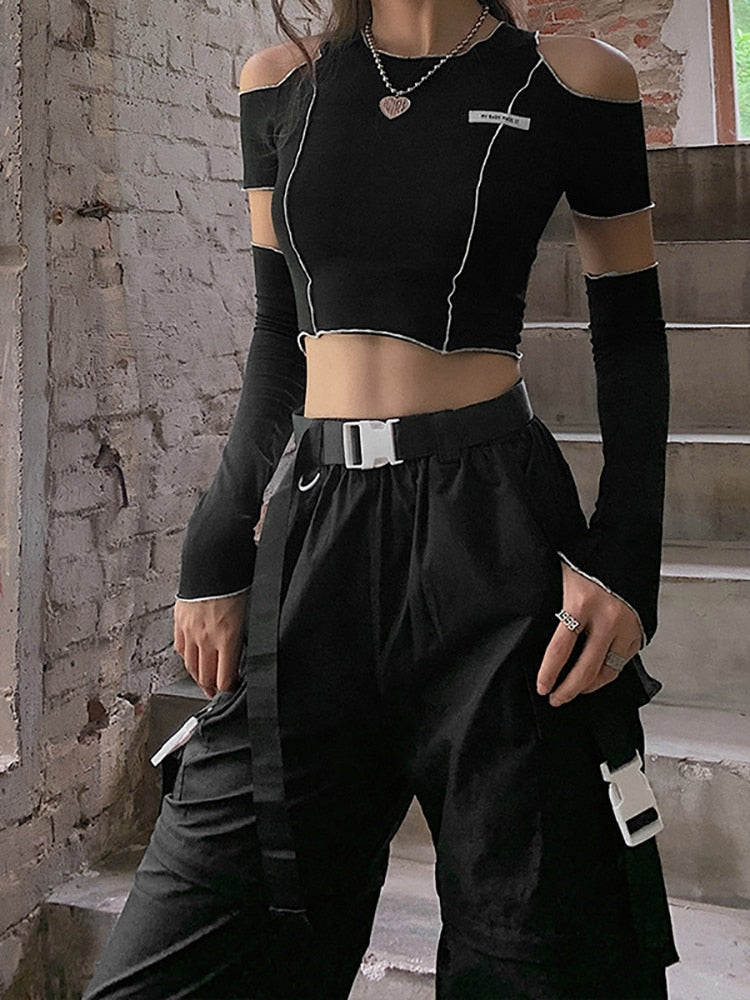 "Gothic-inspired crop top featuring a captivating patchwork pattern and chic open shoulders."