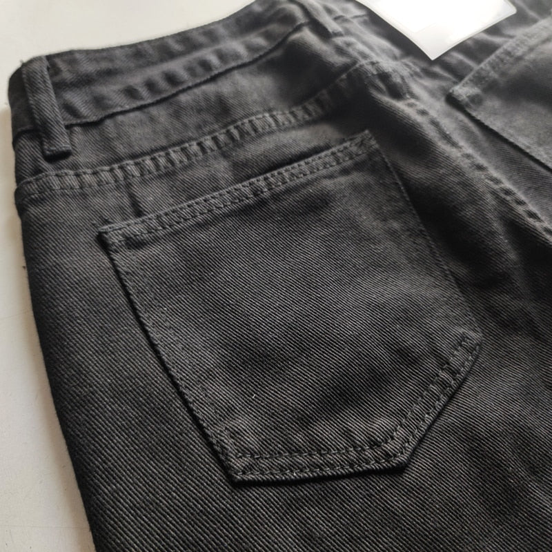 Stylish black jeans with intricate embroidery for a standout look.