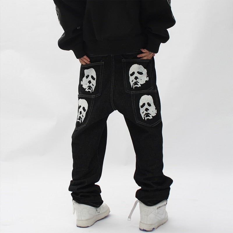 Unique and fashionable baggy jeans with gothic embroidery details.