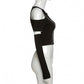 Gothic fashion at its finest, this crop top showcases a striking patchwork pattern and trendy open shoulder silhouette."