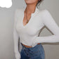 "Black Gothic Crop Top featuring a flattering deep V-neckline and knitted texture