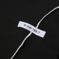 Express your individuality with this Gothic crop top, boasting a captivating patchwork design and daring open shoulders."