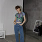 "Unique and fashion-forward, this Dragonfly Crop Top adds a touch of Gothic flair."