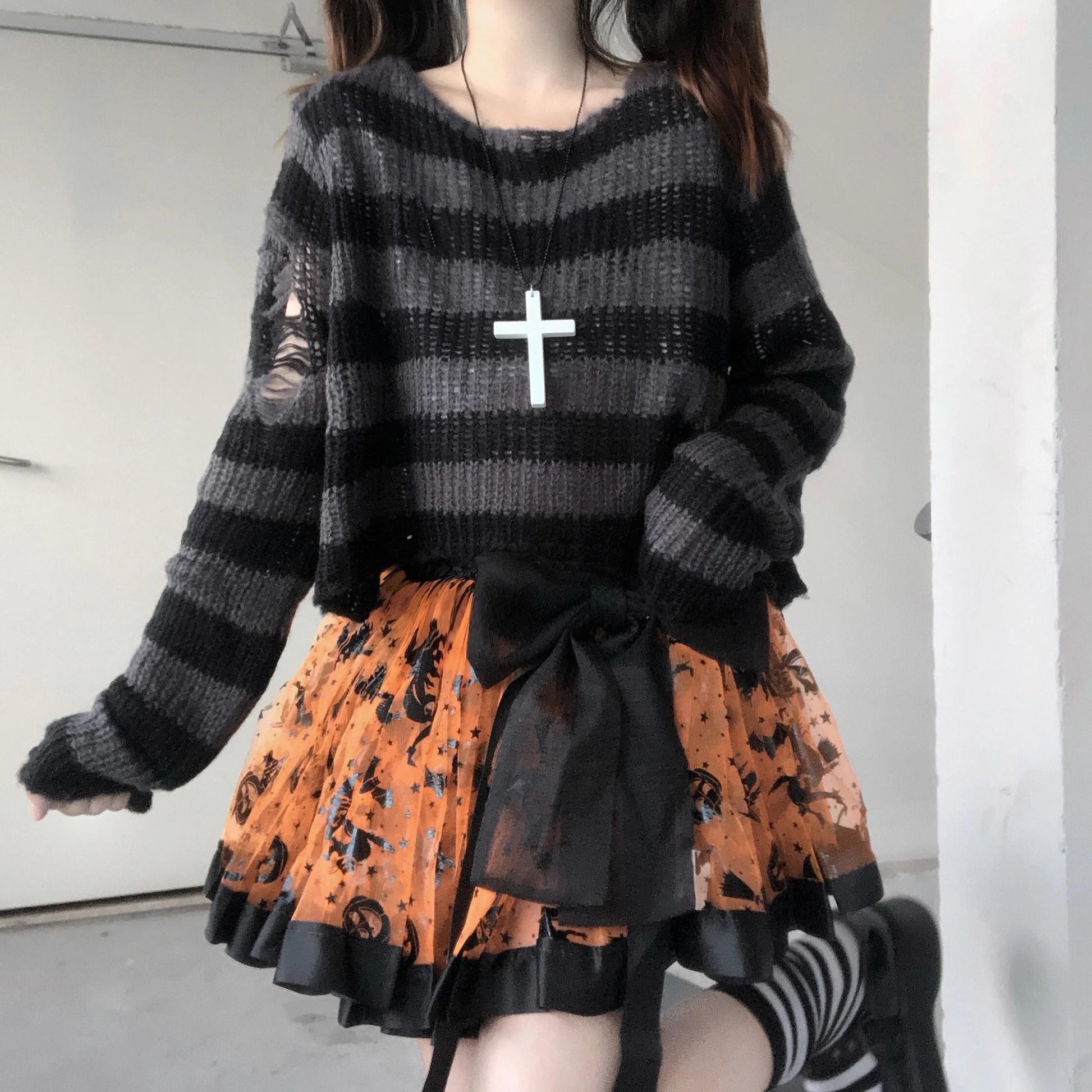 Alternative fashion jumper with grunge stripes and a unique aesthetic.
