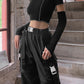 Bold and fashionable Gothic crop top with eye-catching patchwork and edgy open shoulder style."