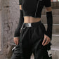 "Gothic-inspired crop top featuring a captivating patchwork pattern and chic open shoulders."