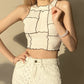 Punk-inspired sleeveless crop top for an edgy look